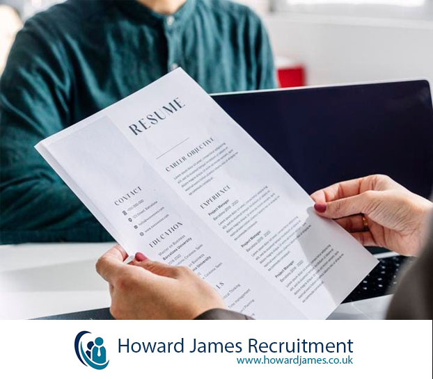 A hiring manager reviewing CVs A hiring manager reviewing CVs