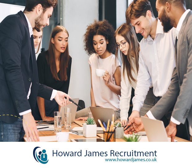 A busy office scene with people collaborating