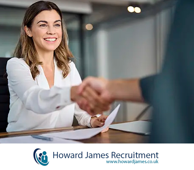 A hiring manager shaking hands with a newly hired employee. A hiring manager shaking hands with a newly hired employee.