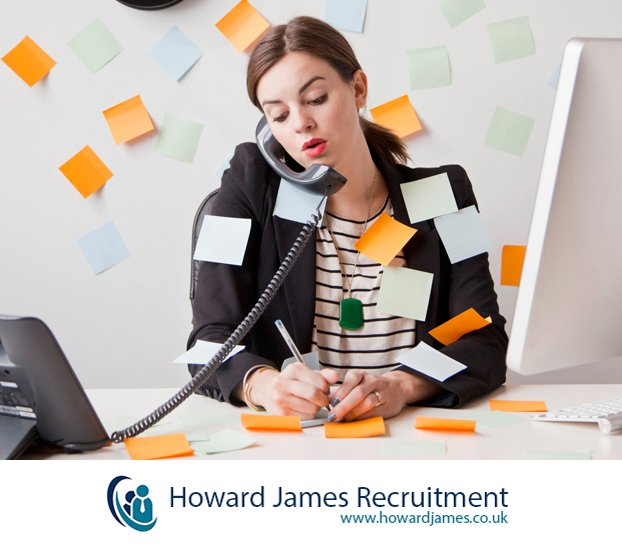 A manager juggling multiple tasks while trying to review CVs looking slightly overwhelmed but determined A manager juggling multiple tasks while trying to review CVs looking slightly overwhelmed but determined