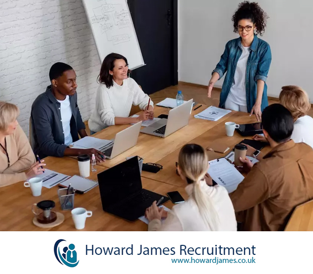 A team of professionals returning to the office after a long weekend, looking energised and ready to tackle hiring challenges A team of professionals returning to the office after a long weekend, looking energised and ready to tackle hiring challenges