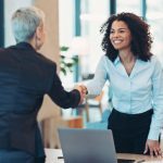 Businesswomen shaking hands in the office